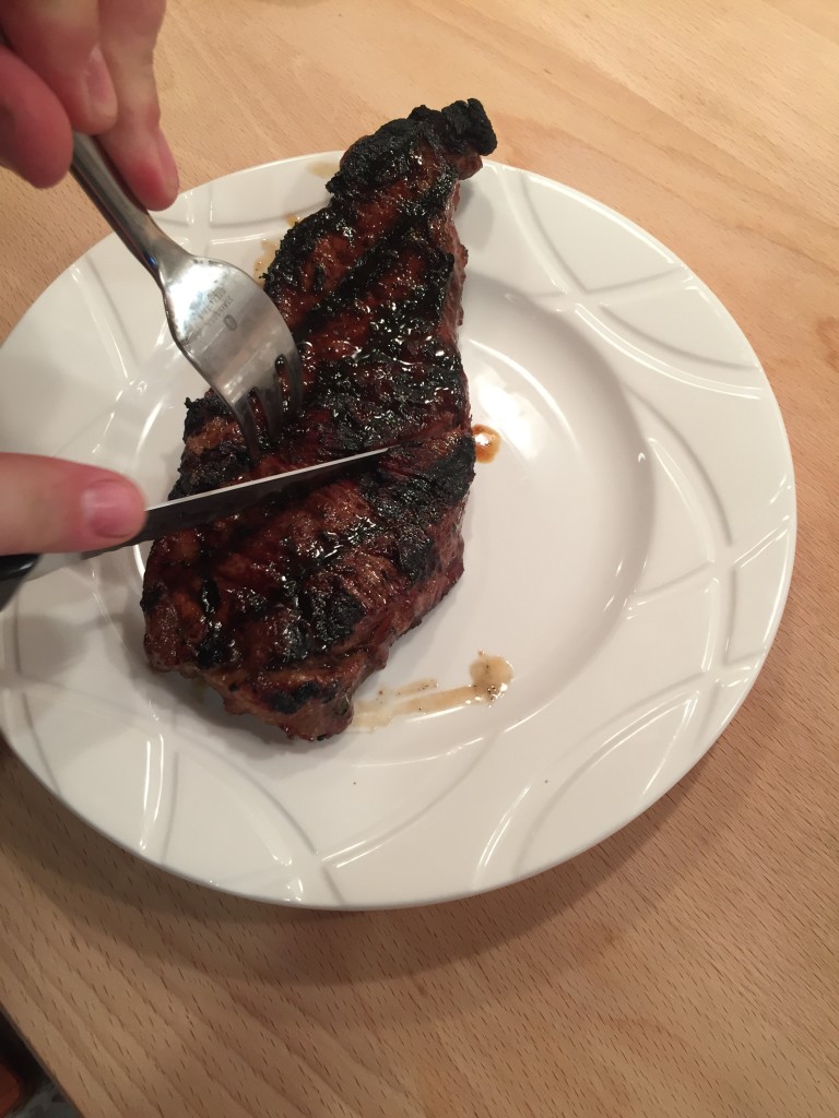 We cut into the first steak immediately after taking it off the grill. 