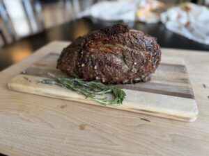 boneless-prime-rib-roast-garlic-herb-butter-easy-recipe-oven-roasted-ingredients-rest-before-slicing